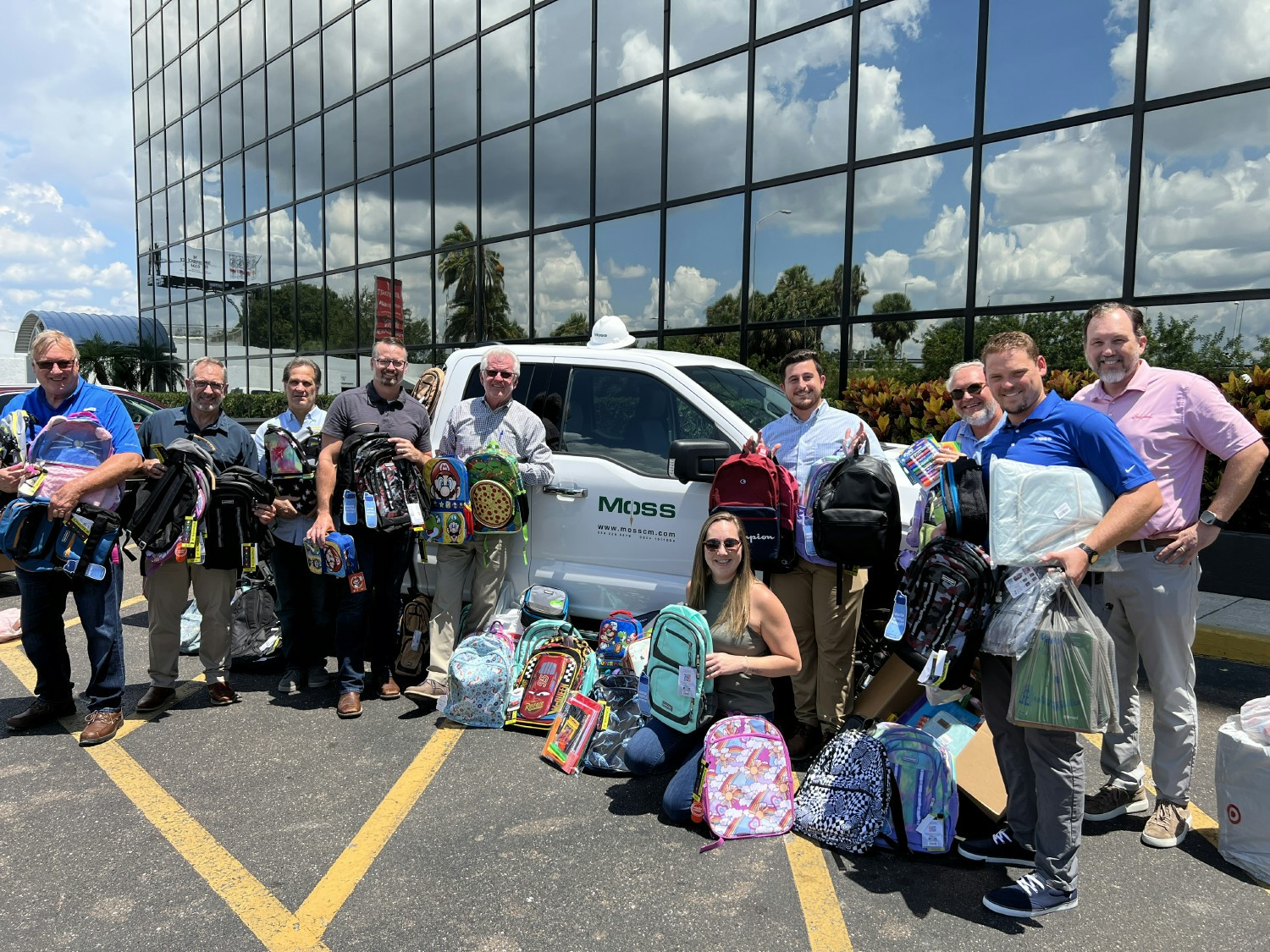 Moss team members dropping off school supplies to a local elementary school.